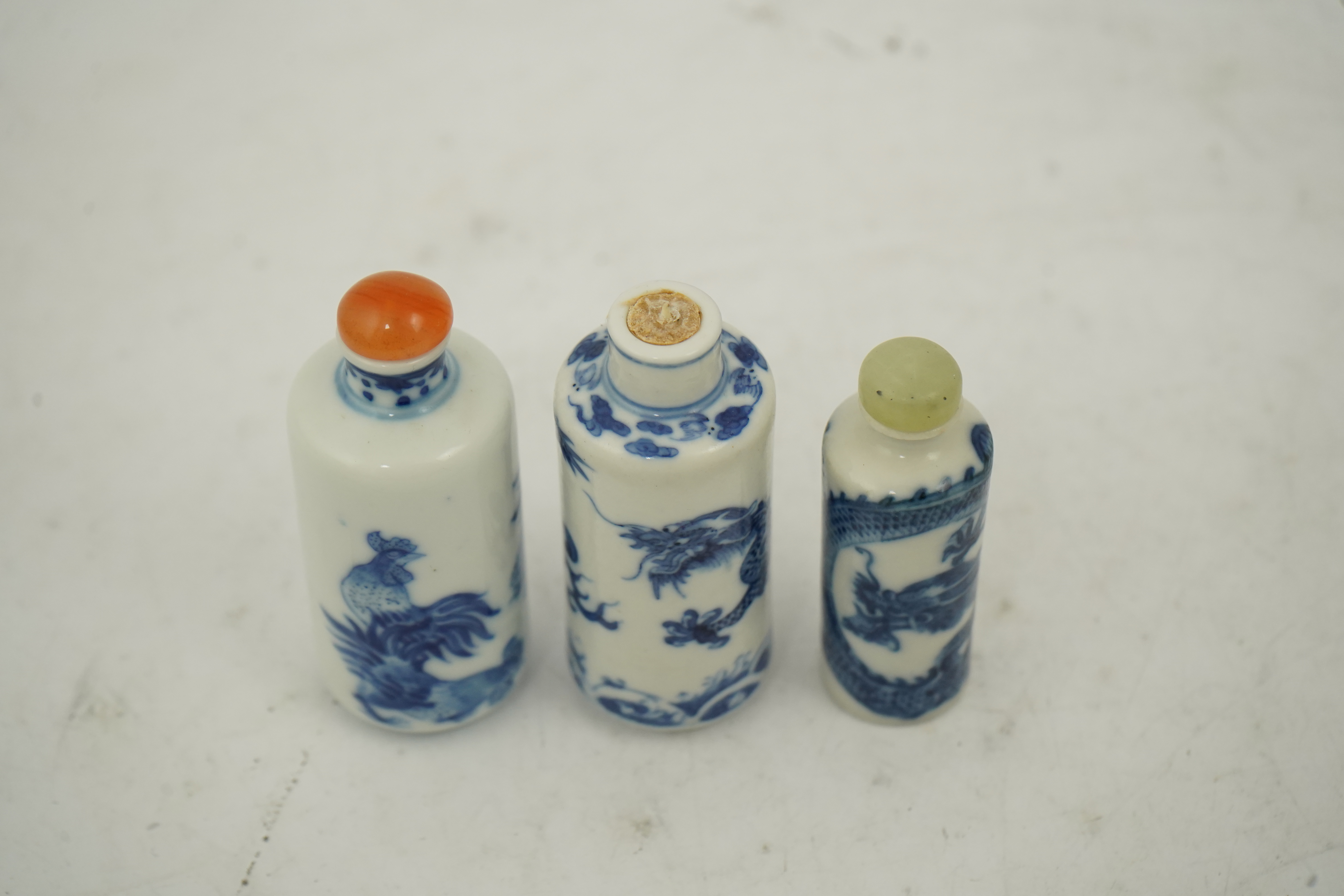 Three Chinese blue and white snuff bottles, c.1850-1900